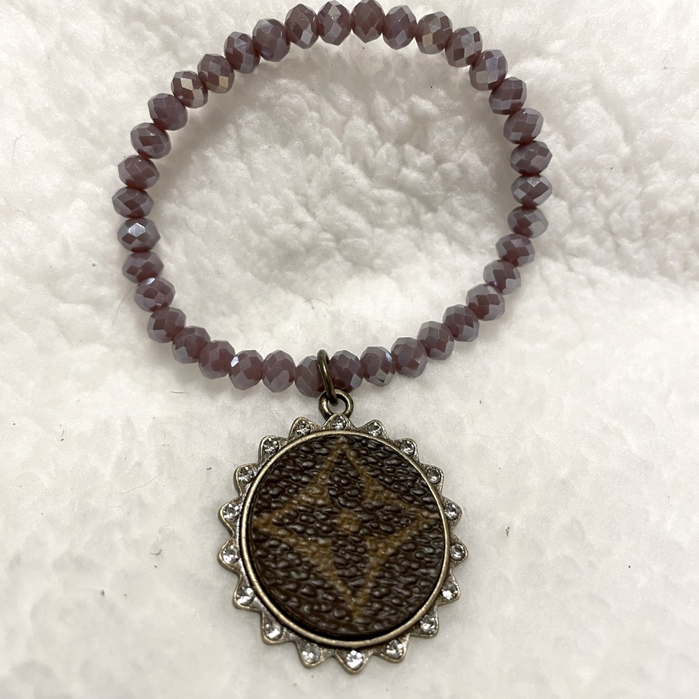 Upcycle, purple beaded, stretch bracelet. Never worn.